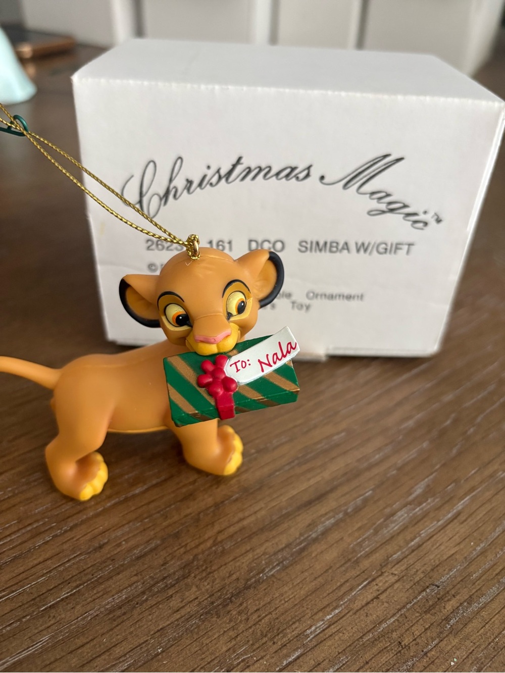 Disney Yellow Simba Ornament Holding Green Gift